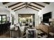 Spacious Gathering room with comfortable seating, a large TV, and access to the backyard at 7305 E Royal Palm Rd, Scottsdale, AZ 85258