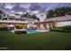 Back exterior view of a stunning home with pool and landscaping at 7305 E Royal Palm Rd, Scottsdale, AZ 85258