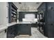 Laundry room with modern appliances and ample storage at 7305 E Royal Palm Rd, Scottsdale, AZ 85258