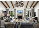Bright living room with comfortable seating, fireplace, and large windows at 7305 E Royal Palm Rd, Scottsdale, AZ 85258