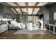 Spacious main bedroom with a four-poster bed, sitting area, and fireplace at 7305 E Royal Palm Rd, Scottsdale, AZ 85258