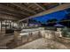 Outdoor kitchen with brick grill island and appliances at 7305 E Royal Palm Rd, Scottsdale, AZ 85258