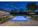 Luxury pool with lounge chairs, string lights, and spa at 7305 E Royal Palm Rd, Scottsdale, AZ 85258