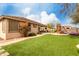 Charming backyard with artificial grass, a play structure, and a landscaped border at 7709 S 72Nd Dl, Laveen, AZ 85339