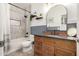 Bathroom featuring a wood vanity, black fixtures, and an updated shower and bathtub at 7709 S 72Nd Dl, Laveen, AZ 85339