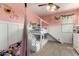 Bright and sunny room with a bunk bed, a ceiling fan, and pink walls at 7709 S 72Nd Dl, Laveen, AZ 85339