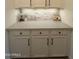 Stylishly decorated counter space featuring decorative backsplash and modern fixtures, perfect for serving and food prep at 7709 S 72Nd Dl, Laveen, AZ 85339