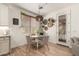 Charming dining area with a round table and views of the backyard at 7709 S 72Nd Dl, Laveen, AZ 85339