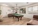 Large, open game room with a billiard table and plenty of space for entertaining Gathering and friends at 7709 S 72Nd Dl, Laveen, AZ 85339