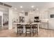 Modern kitchen with a large island, stainless steel appliances, and stylish white cabinets at 7709 S 72Nd Dl, Laveen, AZ 85339