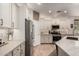Bright kitchen with stainless appliances and modern white cabinets at 7709 S 72Nd Dl, Laveen, AZ 85339