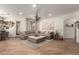 The open-concept living space features a large sectional sofa and a neutral color palette for a relaxing atmosphere at 7709 S 72Nd Dl, Laveen, AZ 85339
