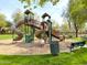Community playground with slides and climbing structures at 7709 S 72Nd Dl, Laveen, AZ 85339