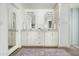 Bathroom with double vanity, granite countertops and large mirror at 7834 E North Ln, Scottsdale, AZ 85258