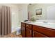 Bathroom with a double vanity, tub, and decorative rug at 832 E Stottler Dr, Gilbert, AZ 85296