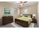 Bright bedroom with a queen bed and wood dresser at 832 E Stottler Dr, Gilbert, AZ 85296