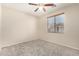 Simple bedroom with ceiling fan and window coverings at 832 E Stottler Dr, Gilbert, AZ 85296