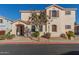 Two-story house with tan exterior, landscaped yard, and two-car garage at 832 E Stottler Dr, Gilbert, AZ 85296