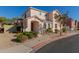 Two-story house with tan exterior, landscaped yard, and two-car garage at 832 E Stottler Dr, Gilbert, AZ 85296