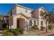 Two-story house with tan exterior, landscaped yard, and two-car garage at 832 E Stottler Dr, Gilbert, AZ 85296