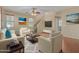 Spacious living room with light beige furniture, a large TV, and high ceilings at 832 E Stottler Dr, Gilbert, AZ 85296