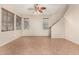 Spacious living room with tile floors and ceiling fan at 832 E Stottler Dr, Gilbert, AZ 85296