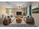 Spacious living room with comfortable seating and a large TV at 832 E Stottler Dr, Gilbert, AZ 85296