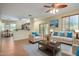 Open concept living room and kitchen area with comfortable seating and tile flooring at 832 E Stottler Dr, Gilbert, AZ 85296