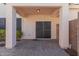Covered patio with brick pavers and sliding glass door access at 832 E Stottler Dr, Gilbert, AZ 85296