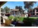 Community view showcasing lush landscaping, pool, and residential buildings at 9711 E Mountain View Rd # 1545, Scottsdale, AZ 85258