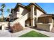 Attractive exterior of a two-story condo building with landscaping and walkway at 9711 E Mountain View Rd # 1545, Scottsdale, AZ 85258