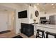 Modern kitchen with breakfast bar and built-in fireplace at 9711 E Mountain View Rd # 1545, Scottsdale, AZ 85258