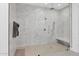 Large walk-in shower with multiple shower heads and built-in bench at 9942 E Desert Beauty Dr, Scottsdale, AZ 85255