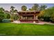 A beautiful backyard with a built-in covered BBQ and bar area at 5747 E Mockingbird Ln, Paradise Valley, AZ 85253