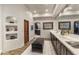 Stylish bathroom showcasing modern fixtures, dual sinks, and textured walls at 5747 E Mockingbird Ln, Paradise Valley, AZ 85253