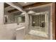 This stylish bathroom features a vessel sink, textured walls and a patterned tile shower with glass doors at 5747 E Mockingbird Ln, Paradise Valley, AZ 85253