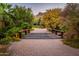 Charming wooden bridge over a serene pathway with desert landscaping and mountain views at 5747 E Mockingbird Ln, Paradise Valley, AZ 85253