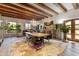Elegant dining room showcasing beamed ceiling, chandelier, and french doors at 5747 E Mockingbird Ln, Paradise Valley, AZ 85253
