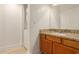 Bathroom with granite countertop vanity and laundry closet at 10610 S 48Th St # 2089, Phoenix, AZ 85044