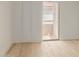 Bedroom with light wood floors and sliding glass door to patio at 10610 S 48Th St # 2089, Phoenix, AZ 85044