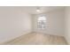 Bright bedroom with wood-look floors and an arched window at 10610 S 48Th St # 2089, Phoenix, AZ 85044