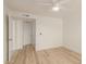 Bright bedroom with wood-look floors and access to closets at 10610 S 48Th St # 2089, Phoenix, AZ 85044
