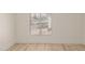 Light-filled bedroom featuring wood-look floors and window blinds at 10610 S 48Th St # 2089, Phoenix, AZ 85044