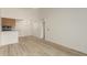 Open concept dining room and kitchen with light wood floors at 10610 S 48Th St # 2089, Phoenix, AZ 85044