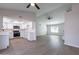 Open concept kitchen and living area with vaulted ceilings and vinyl plank flooring at 110 W San Pedro Ave, Gilbert, AZ 85233