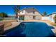 Inviting kidney shaped pool, perfect for relaxation at 1125 E Huber St, Mesa, AZ 85203