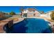 Inviting backyard pool with waterfall feature and lounge chairs at 1125 E Huber St, Mesa, AZ 85203