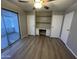 Bedroom with built-in desk and sliding glass door to patio at 120 N Val Vista Dr # 38, Mesa, AZ 85213