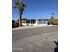 Mobile home with covered patio and desert landscaping at 120 N Val Vista Dr # 38, Mesa, AZ 85213