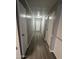 Long hallway with multiple doors and hardwood floors at 120 N Val Vista Dr # 38, Mesa, AZ 85213
